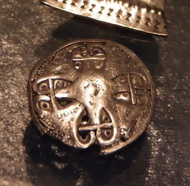 A cross on a brooch